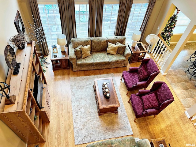 living room with a wealth of natural light and hardwood / wood-style floors