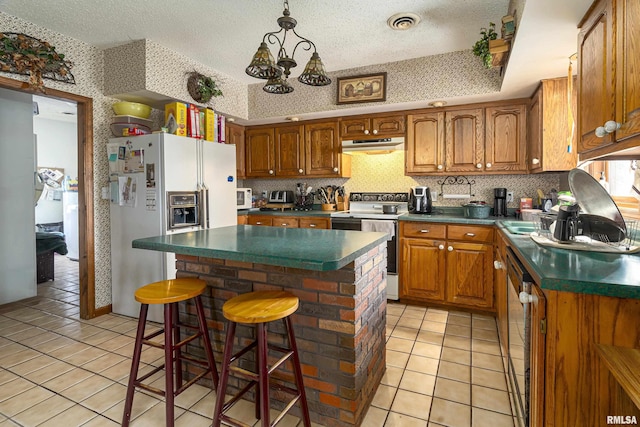 kitchen featuring a center island, range with electric cooktop, white fridge with ice dispenser, light tile patterned floors, and a kitchen bar