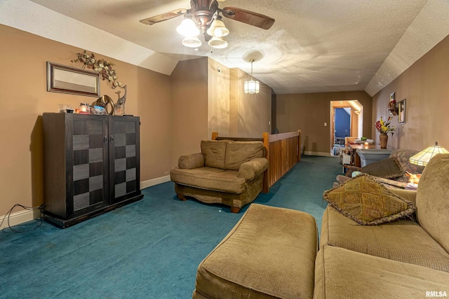 living room with dark colored carpet, ceiling fan, lofted ceiling, and a textured ceiling