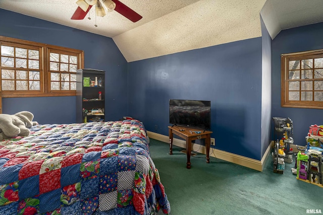 bedroom featuring a textured ceiling, ceiling fan, carpet, and vaulted ceiling