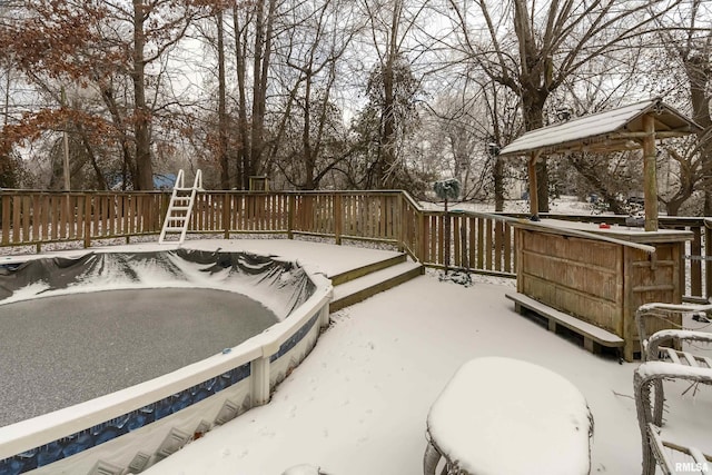 snow covered patio with a gazebo