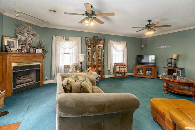 living room featuring dark colored carpet, ceiling fan, crown molding, and a textured ceiling