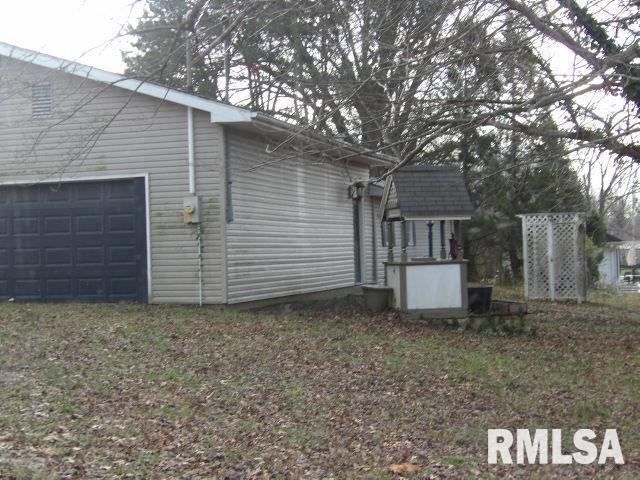 view of side of property featuring a garage