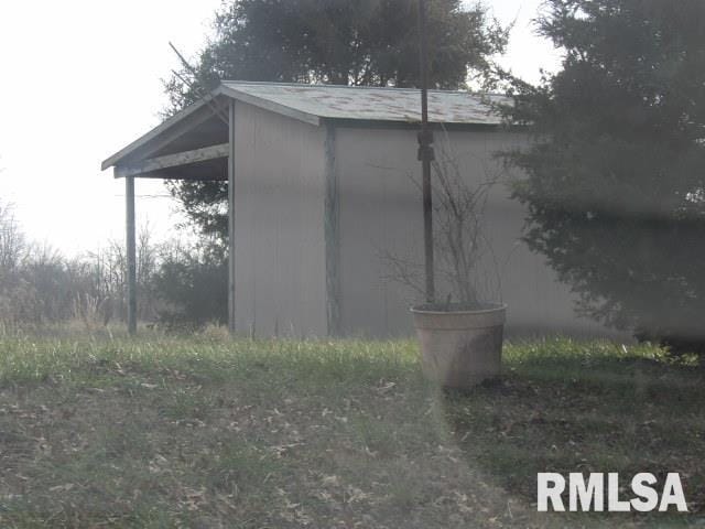 view of side of property featuring an outdoor structure