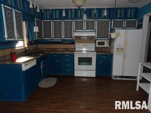 kitchen with white appliances, a sink, dark wood finished floors, and blue cabinets