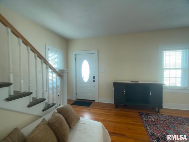 entryway with hardwood / wood-style floors