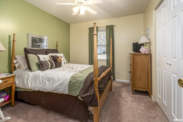 carpeted bedroom featuring a closet and ceiling fan