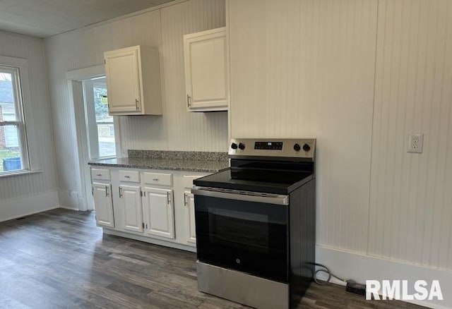 kitchen with white cabinetry, stainless steel range with electric cooktop, dark wood-type flooring, and light stone counters