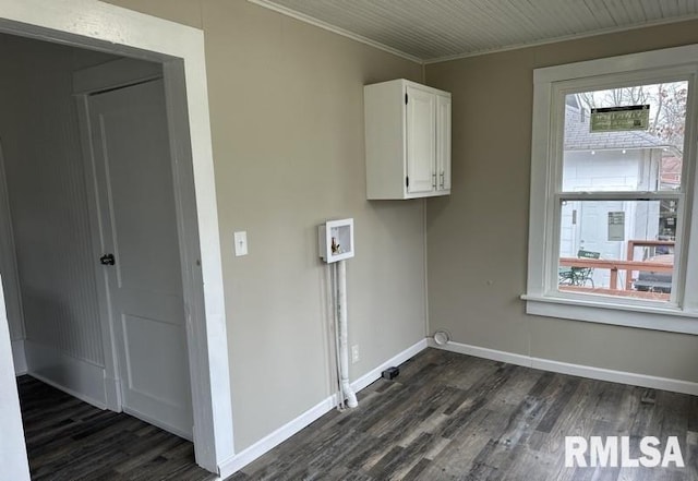 laundry room featuring washer hookup, plenty of natural light, dark hardwood / wood-style floors, and cabinets