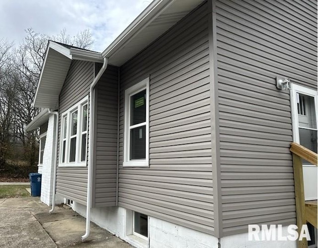 view of side of home featuring a patio