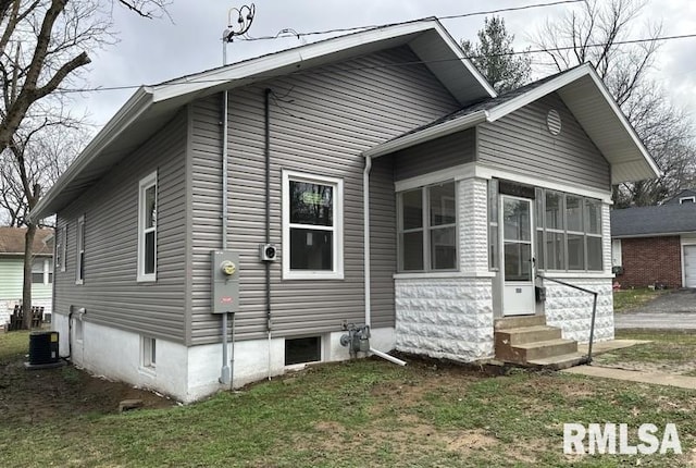 view of home's exterior with cooling unit