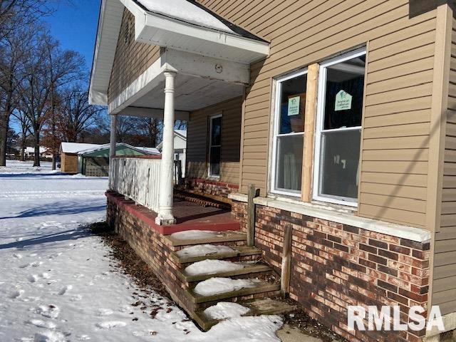 view of snow covered property