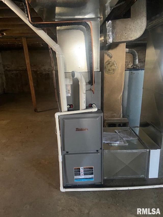 utility room with gas water heater