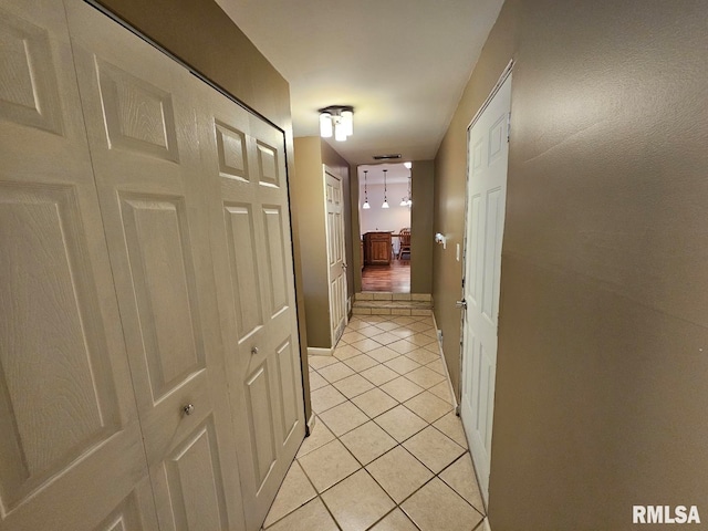 hallway featuring light tile patterned flooring