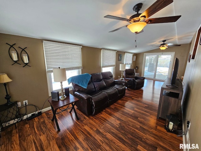 living room featuring ceiling fan and dark hardwood / wood-style flooring