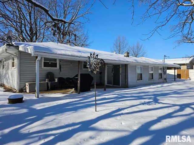 view of snow covered house