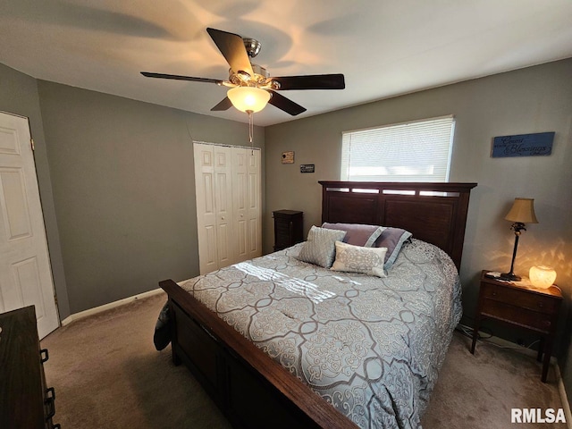 carpeted bedroom featuring a closet and ceiling fan