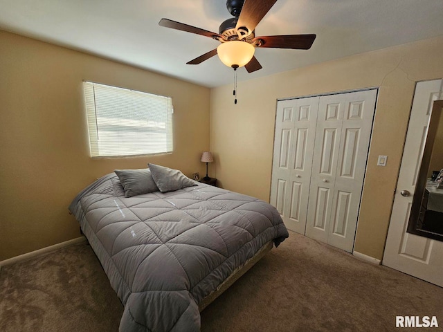 bedroom featuring ceiling fan and dark carpet