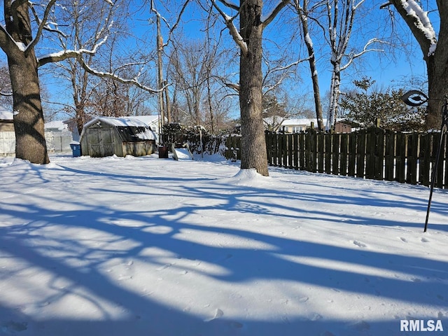 view of yard layered in snow