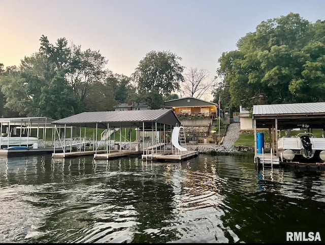 view of dock featuring a water view and boat lift