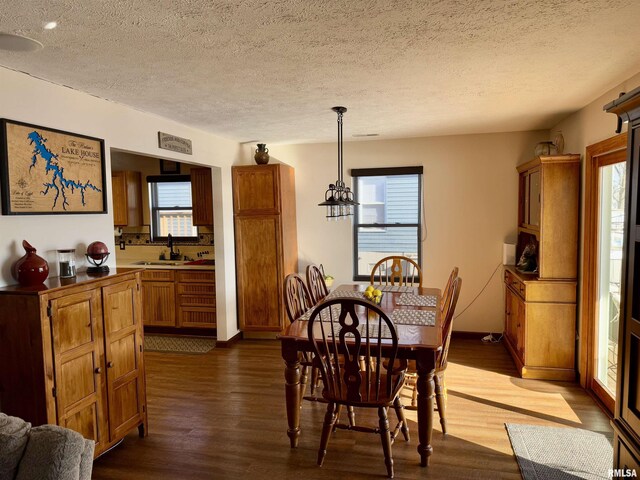 living room with dark hardwood / wood-style flooring, a textured ceiling, and ceiling fan