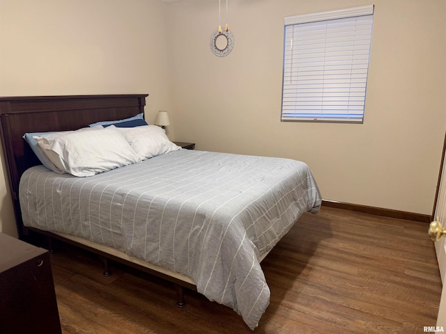 bedroom with wood-type flooring