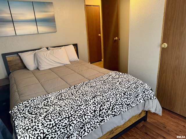 bedroom featuring wood finished floors