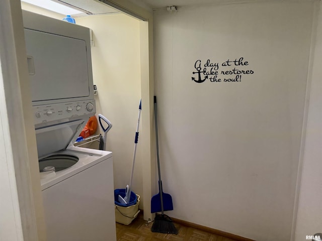 washroom featuring stacked washer and dryer