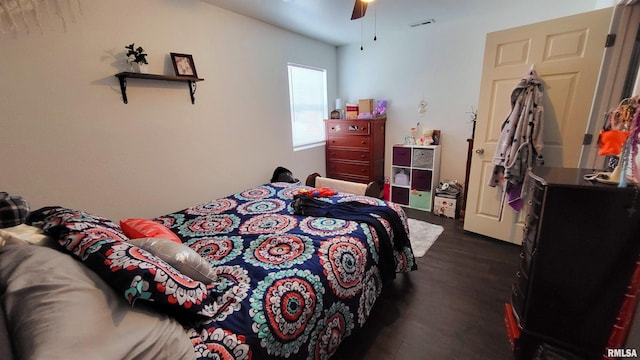 bedroom featuring ceiling fan and dark hardwood / wood-style floors