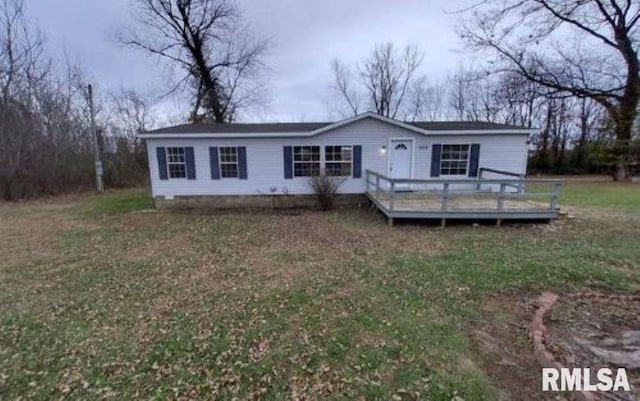 view of front of home with a front yard and a deck