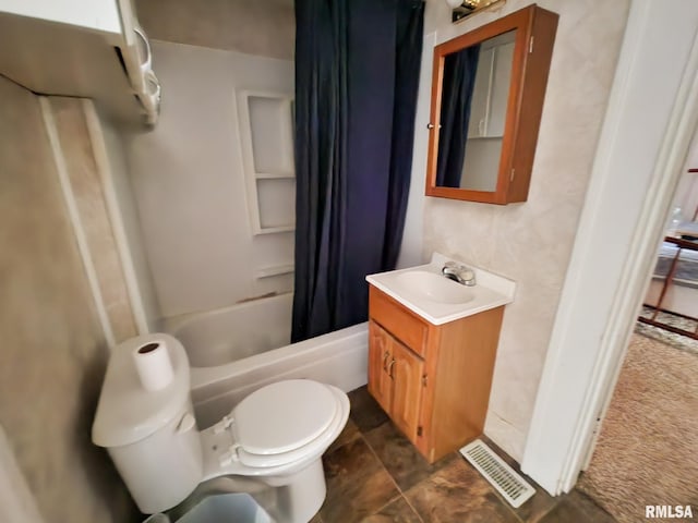 full bathroom featuring vanity, toilet, and shower / bath combo with shower curtain