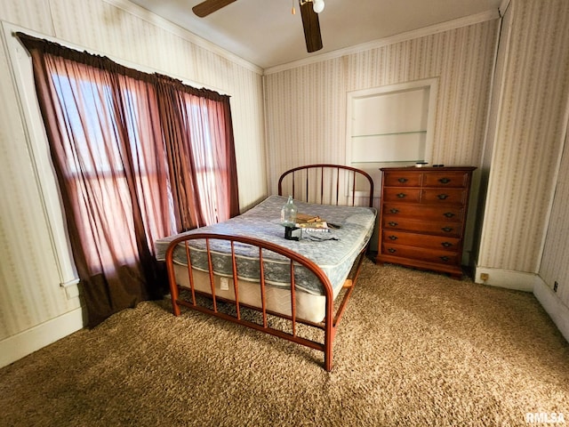 bedroom featuring carpet flooring, ceiling fan, and ornamental molding