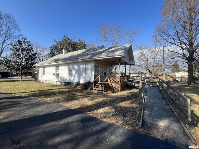 view of property exterior with covered porch