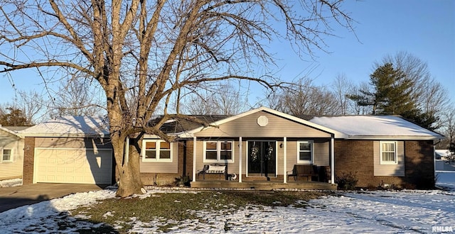 ranch-style house with a porch and a garage