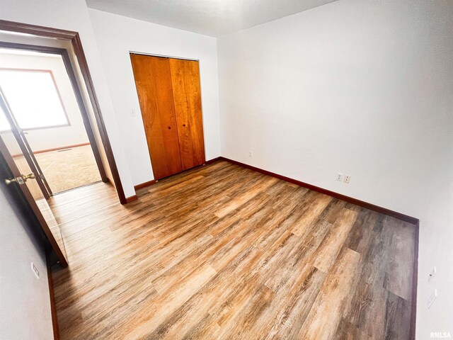 unfurnished bedroom featuring carpet flooring and a textured ceiling