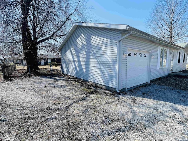 garage with fence