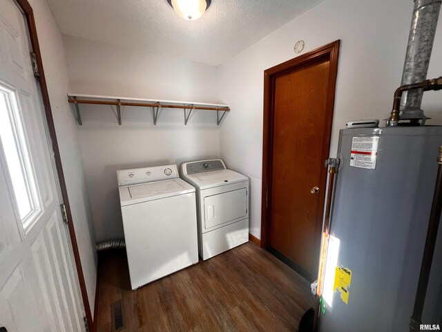 spare room with a textured ceiling and dark hardwood / wood-style flooring