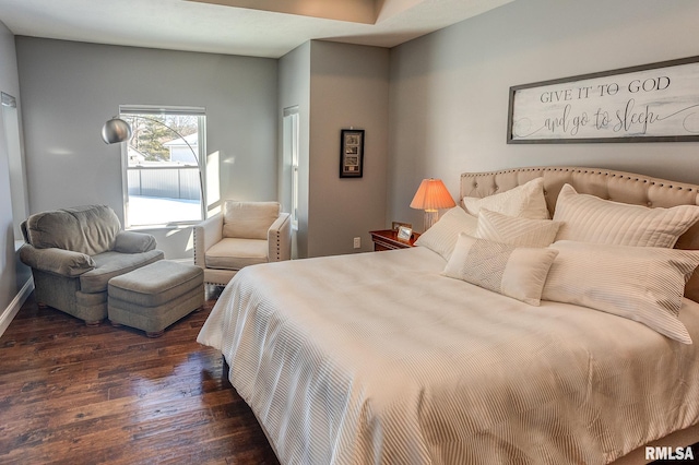 bedroom featuring dark wood-type flooring