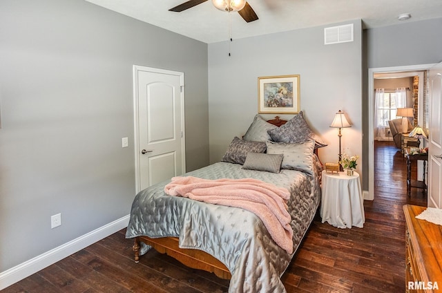 bedroom featuring ceiling fan and dark wood-type flooring