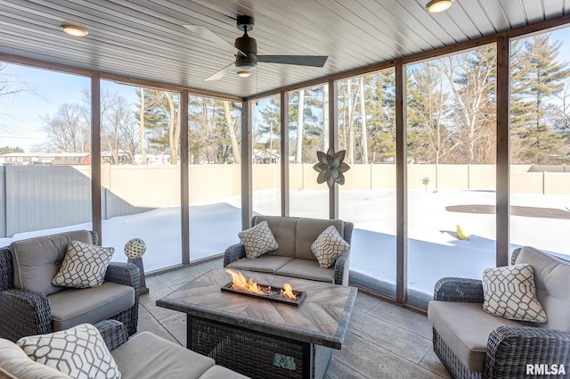 sunroom / solarium with ceiling fan and wooden ceiling