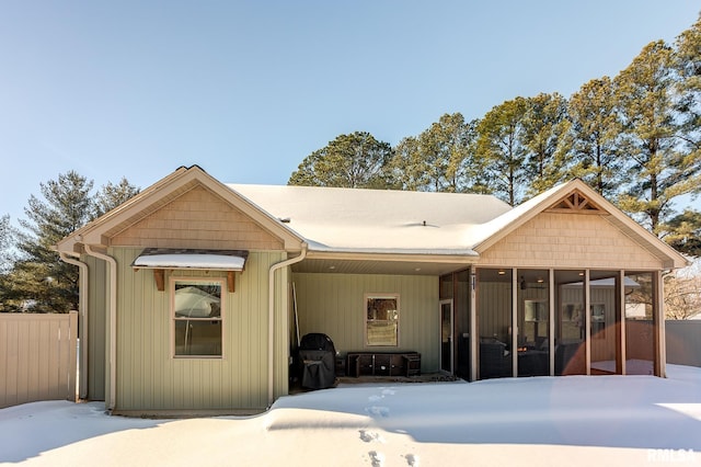 view of front of house featuring a sunroom