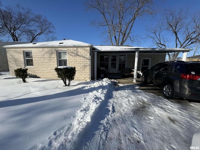 ranch-style home with a carport