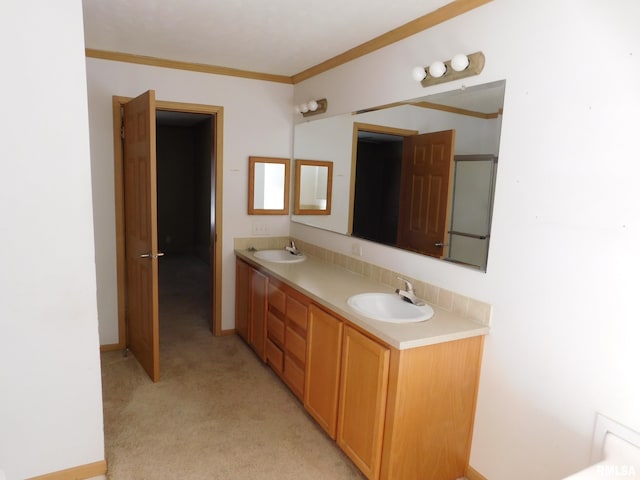 bathroom featuring ornamental molding and vanity