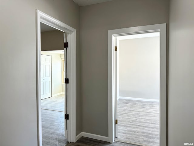 hallway featuring dark hardwood / wood-style flooring