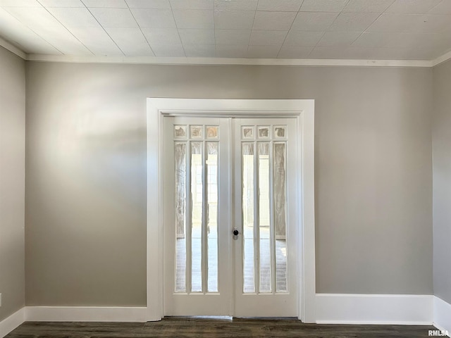 entryway with dark hardwood / wood-style floors and crown molding