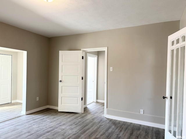 unfurnished bedroom featuring hardwood / wood-style flooring