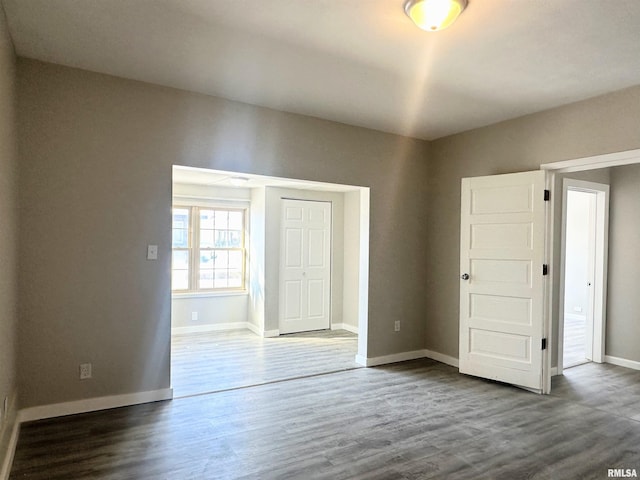 interior space with a closet and dark hardwood / wood-style flooring