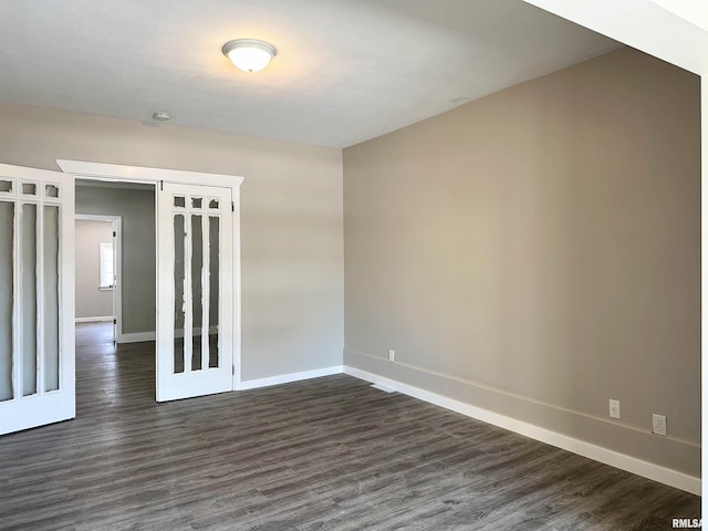 empty room with dark wood-type flooring