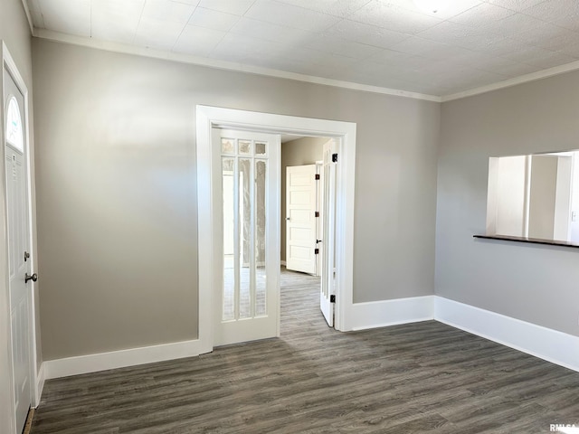 unfurnished room featuring dark hardwood / wood-style floors and ornamental molding