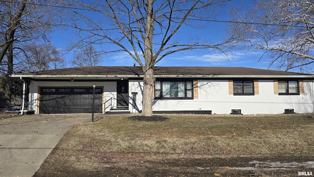 view of front facade with a front yard and a garage